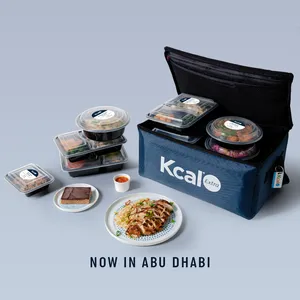 Kcal Meal Plans bag from 2015 with a grey background and healthy meals with text saying now in Abu Dhabi.