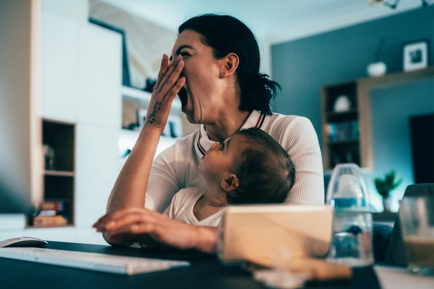 Working woman feeling tired trying to balance work and home life