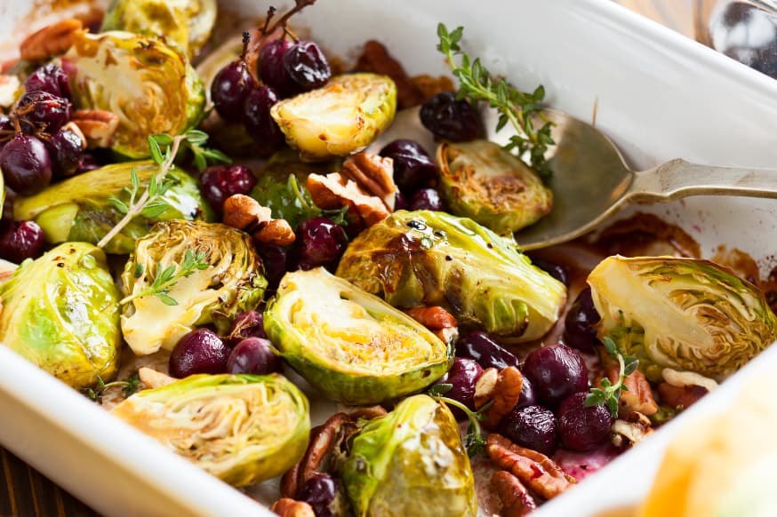 White oven tray of roasted Brussels sprouts