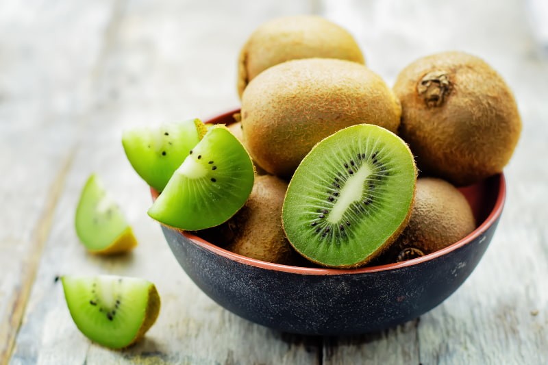 Bowl of cut kiwi fruit high in vitamin C